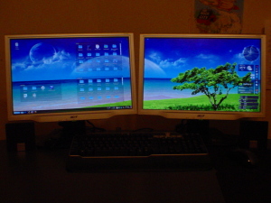 Picture of both monitors showing KDE 4